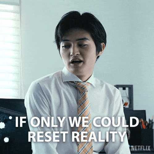 a man in a white shirt and orange tie says " if only we could reset reality "