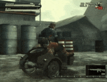 snake and eva are playing a video game where snake is in a wheelchair