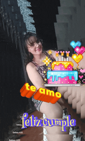 a woman is holding a birthday cake with the words te amo feliz cumple written on it