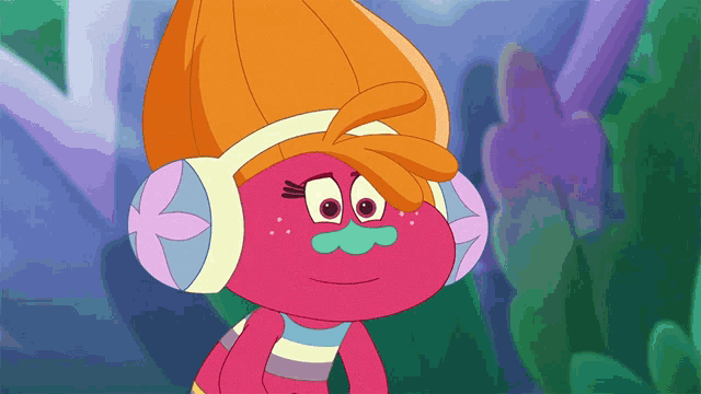 a troll wearing headphones and a scarf