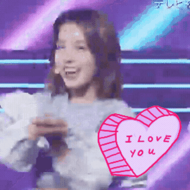 a woman with a pink heart that says i love you on it