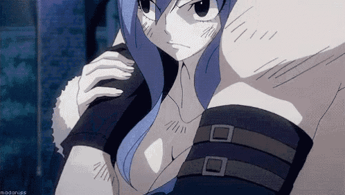 a female anime character with blue hair and a very tight shirt is standing in a dark room .