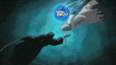 a picture of a man in the water with ndx 6900 in the corner