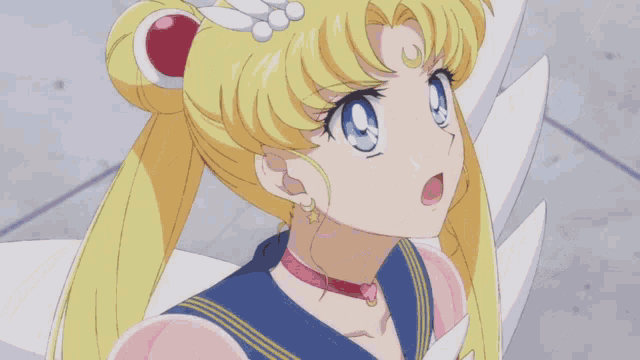 a close up of a sailor moon anime character with a surprised look on her face