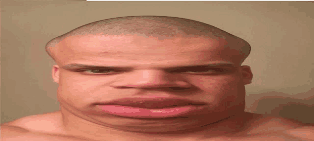 a man with a shaved head has a big mouth