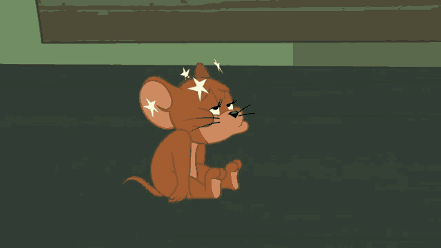 jerry from tom and jerry sits on the floor