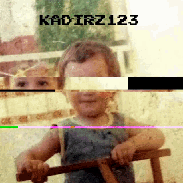 a blurry picture of a child with the words kadirz123 on the top