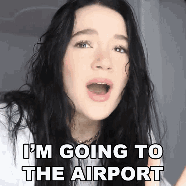 a woman says i 'm going to the airport with her mouth wide open