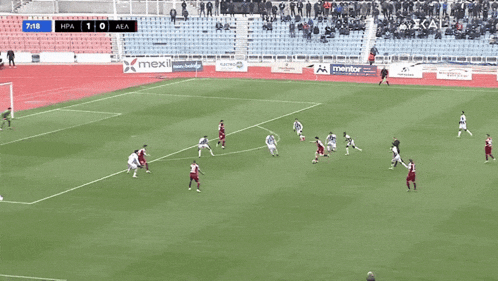 a soccer game is being played and the score is 1-0
