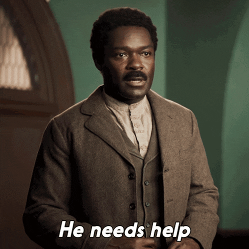 a man in a brown suit says he needs help