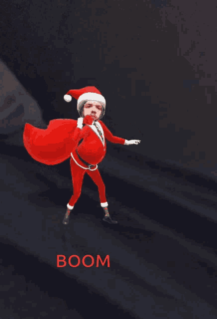 a cartoon of a man dressed as santa claus holding a red bag with the word boom below him