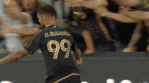 a soccer player with the number 99 on his jersey