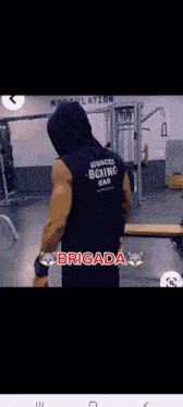 a man wearing a hooded tank top that says advanced boxing gear
