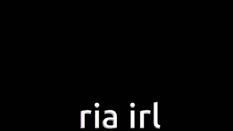 a purple and white x with the words `` ria irl '' on it .