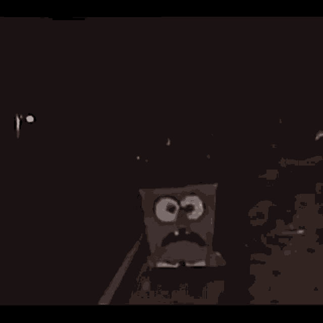 a spongebob squarepants character is standing in the dark with a surprised look on his face .