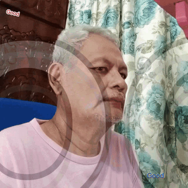 a man in a pink shirt with the word good on the bottom left