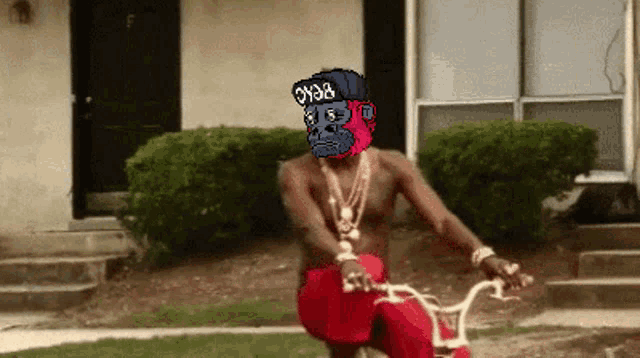 a pixel art of a man riding a bike with a gorilla head