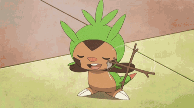 a cartoon character with a green hat is holding a stick in his mouth