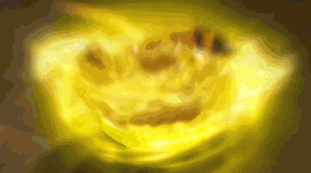 a yellow background with a glowing face on it