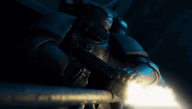 a robot is holding a gun in a dark room and it is glowing