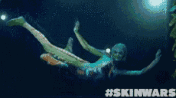 a picture of a person floating in the water with the hashtag skinwars