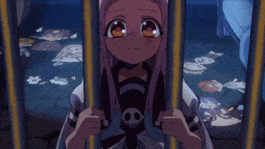 a girl in a cage with a skull on her chest