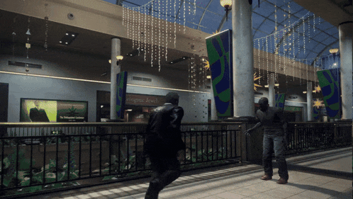 a man walking in a mall with a sign that says morgan jewelers