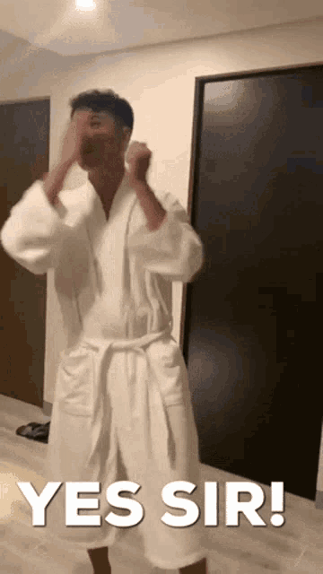 a man in a bathrobe says yes sir in a room