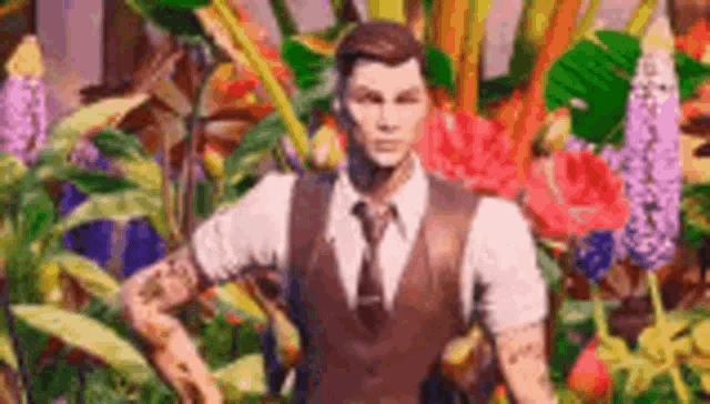 a man in a suit and tie is standing in front of flowers .
