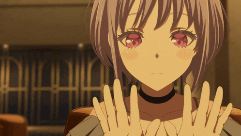 a girl with short hair and red eyes is making a peace sign with her hands