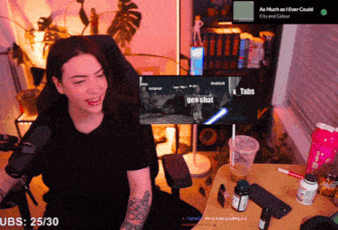 a woman sits in front of a screen that says gen chat on it