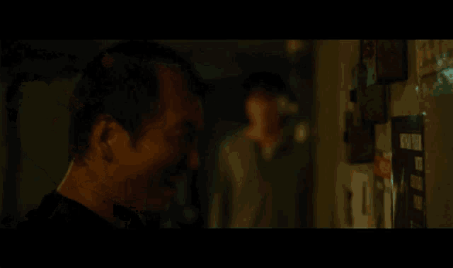 a man in a dark room with the words respect written on the screen