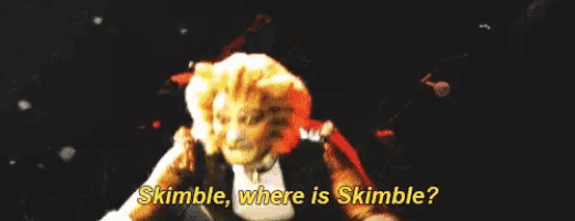 a cat says " skimble where is skimble " in a dark room