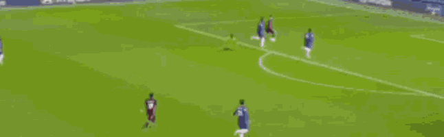 a soccer player wearing a stop jersey is standing in front of a net