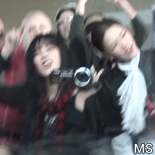 a blurry photo of a group of people with ms written on the bottom