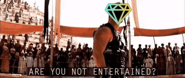 a man with a diamond on his head stands in front of a crowd with the words are you not entertained