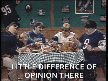 a group of men are sitting around a table with a checkered table cloth and the words little difference of opinion there