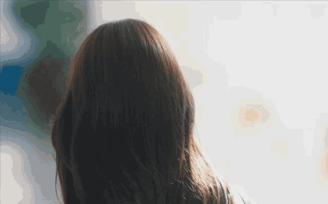 the back of a woman 's head is shown