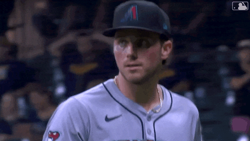a baseball player wearing a hat with the letter a on it