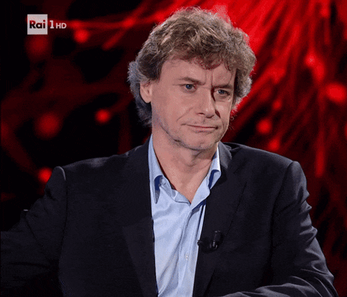 a man in a suit with rai 1 hd written on the bottom
