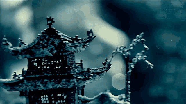 a painting of a pagoda with a blue sky in the background