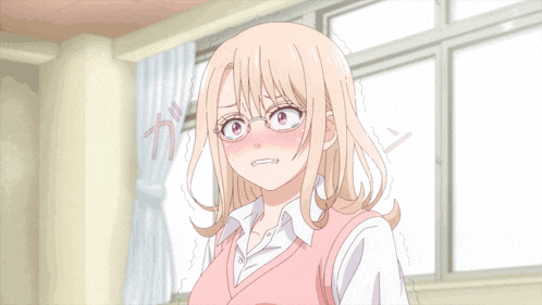 a girl wearing glasses and a pink vest stands in a room