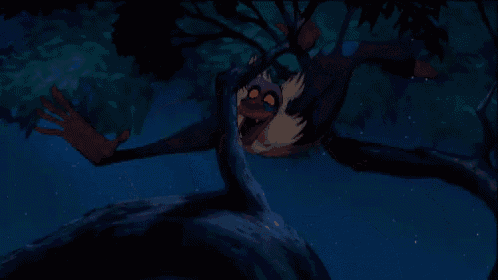 a cartoon character with a beard is sitting on a tree branch at night .