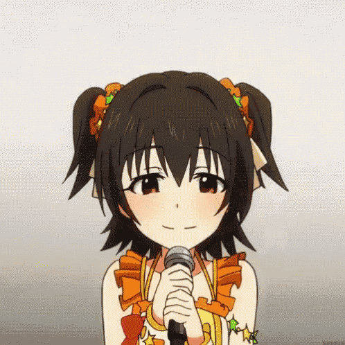 a girl with pigtails is holding a microphone in her hand