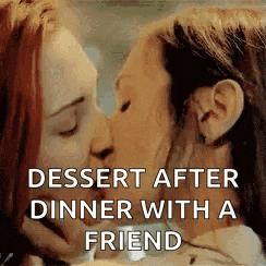 a couple of women are kissing each other after dinner with a friend .