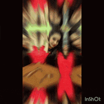 a blurry picture of a woman in a red dress with an x on it