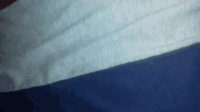 a close up of a white and blue fabric