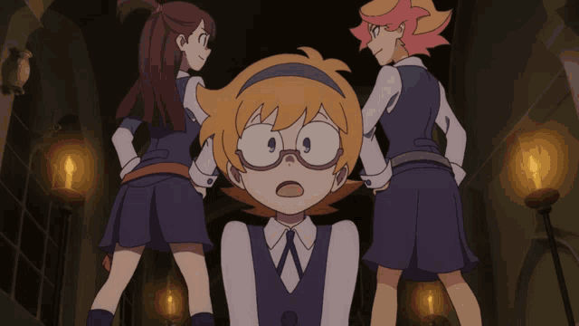 a girl wearing glasses stands between two other girls