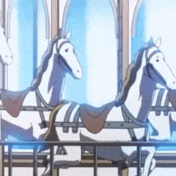 a merry go round with three white horses in a cage