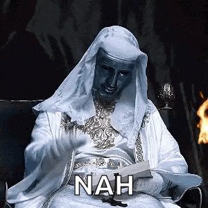 a man in a white robe is sitting in a chair reading a book with the word nah written on it .